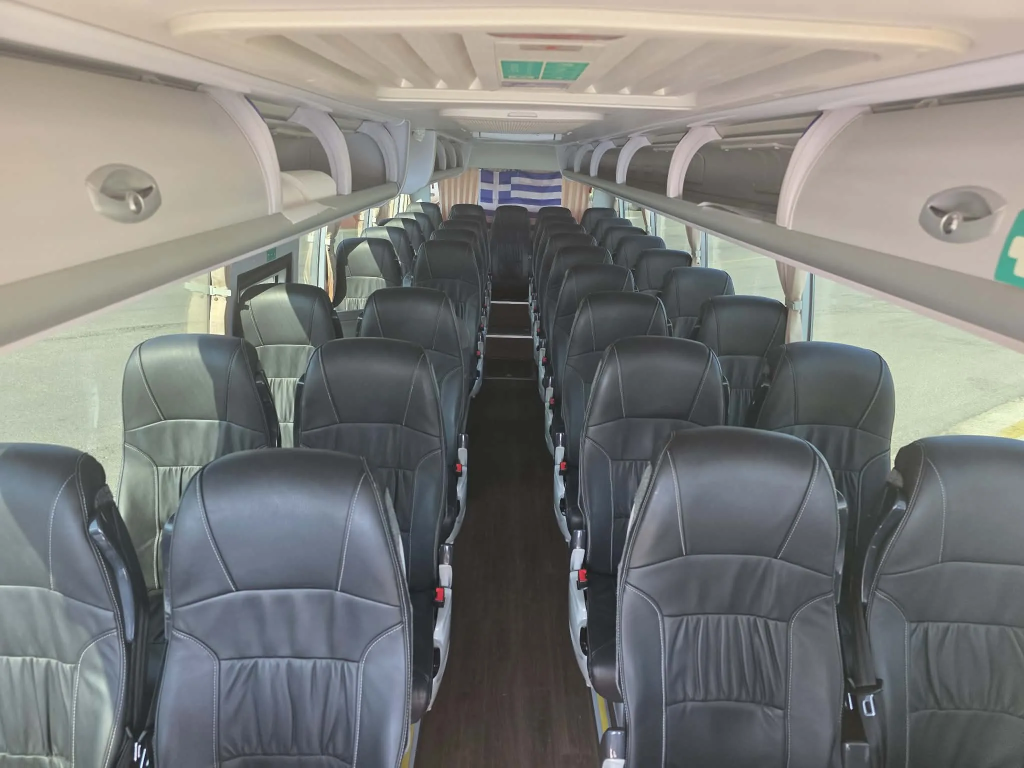Leather seating down the aisle of the 35-seat coach