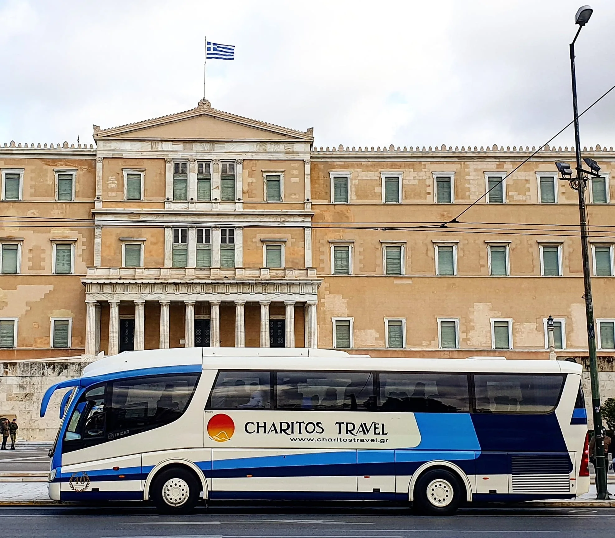 The 51-seat Charitos Travel coach outside the Greek Parliament in Athens
