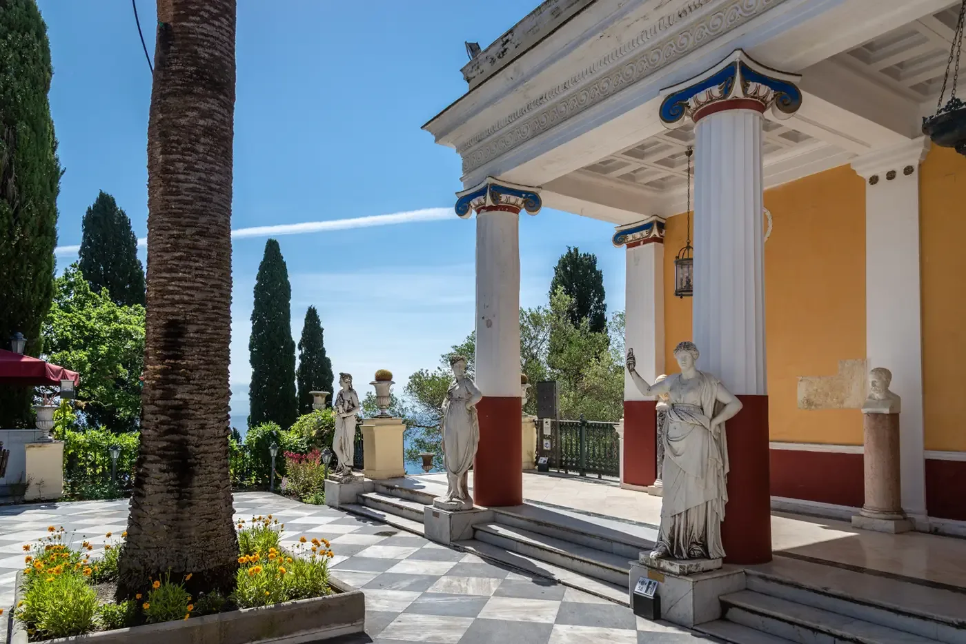 The colonnade of the Achilleion palace, with the sea beyond